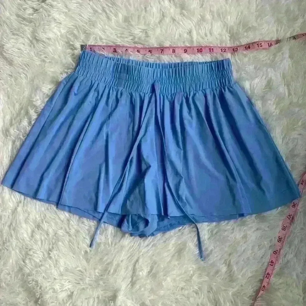 As Revival White Go-with-the-Flow Athletic. Cornflower blue. Size medium. NWOT.